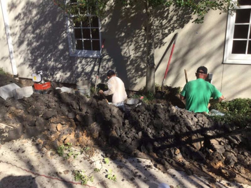men digging a hole