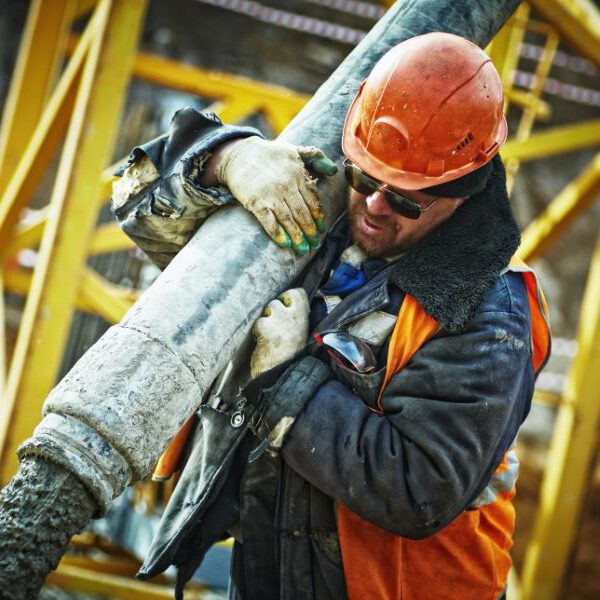 man puoring a concrete mixture